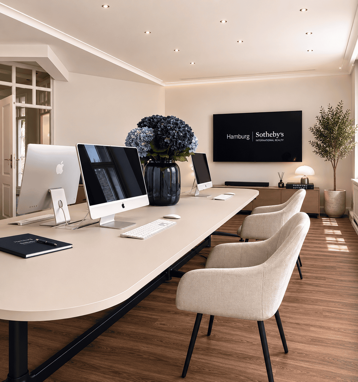 High-quality conference room with Apple computers and modern furnishings in Hamburg.
